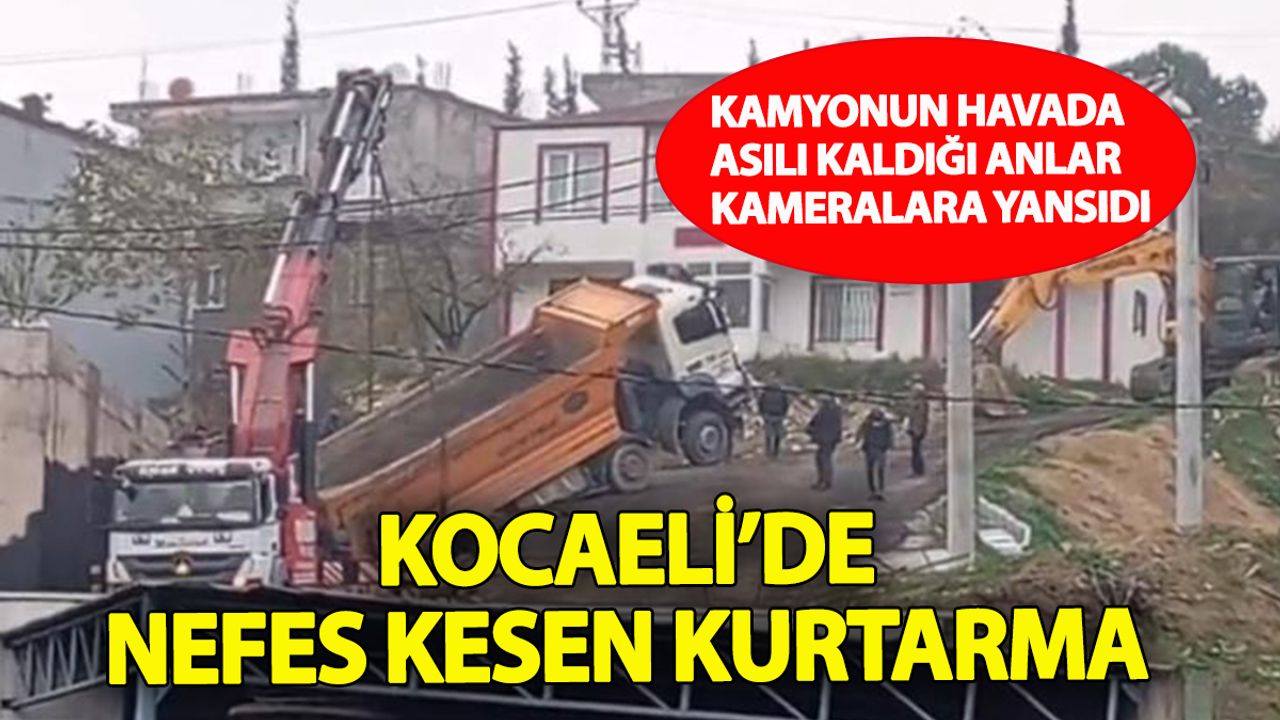 Kamyon askıda kaldı vinçler devreye girdi: Kocaeli’de nefes kesen kurtarma